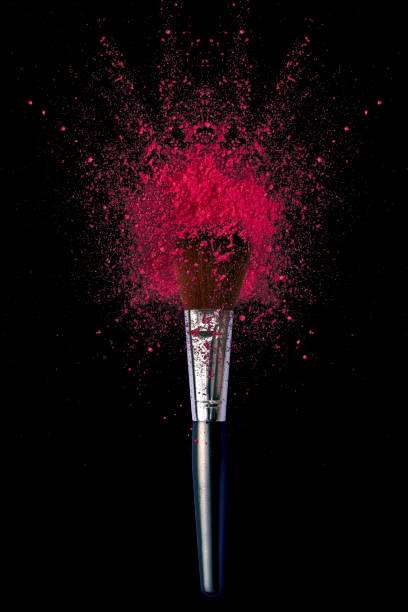 make up brushes with powder explosion on black - foundation paintbrush make up brush femininity imagens e fotografias de stock