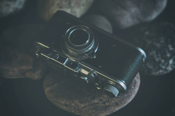 Vintage camera stands on stones