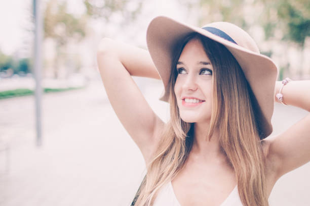istock Smiling Young Beautiful Woman Outdoors in Summer 1018764380