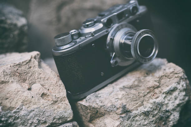 Vintage camera stands on stones