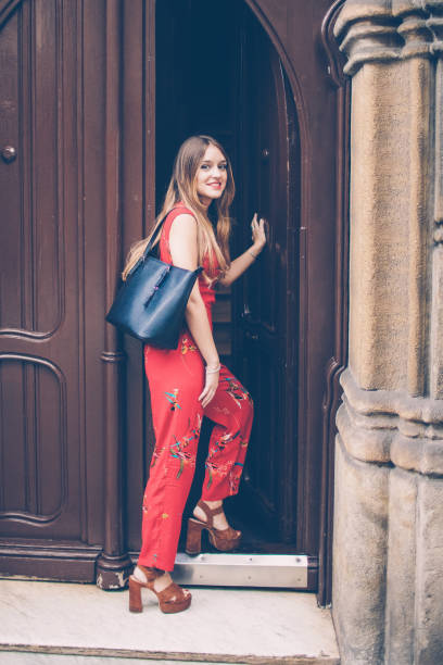 istock Positive attractive lady coming home after stroll 1018764450