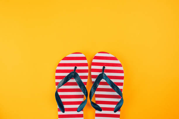 istock Stylish flip flop sandals with USA flag pattern 1018764452