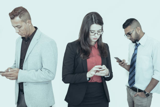istock Serious partners using smartphones at meeting 1018770998
