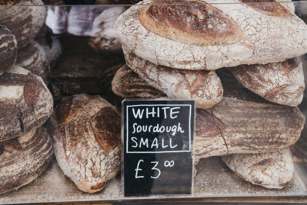 istock Fresh white sourdough bread on sale at a market. 1018782440