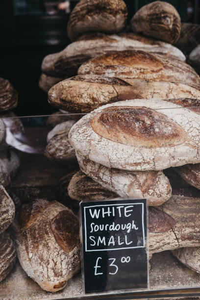 istock Fresh white sourdough bread on sale at a market. 1018782442