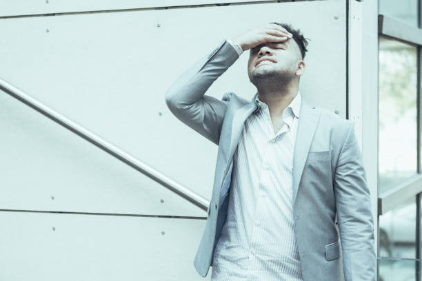 istock Upset Hispanic businessman thinking of problems 1018782710