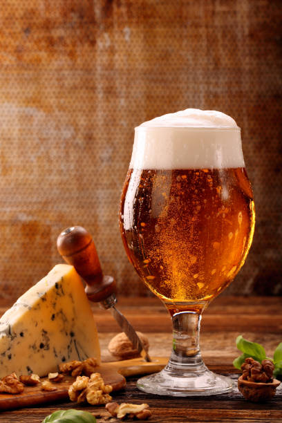 istock Blue cheese appetizer and beer on brown vintage background 1018789128