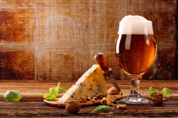 istock Blue cheese appetizer and beer on brown vintage background 1018789136
