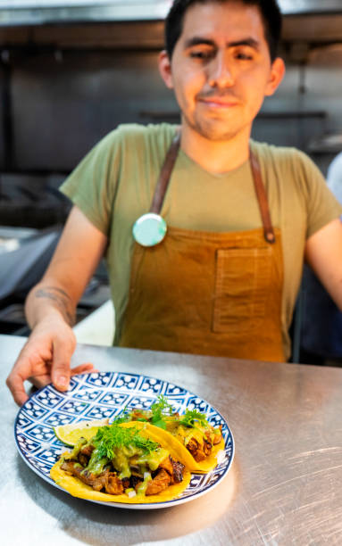 istock Mexican chef working in an authentic Mexican restaurant 1018789266