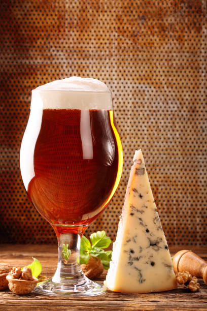 istock Blue cheese appetizer and beer on brown vintage background 1018789432