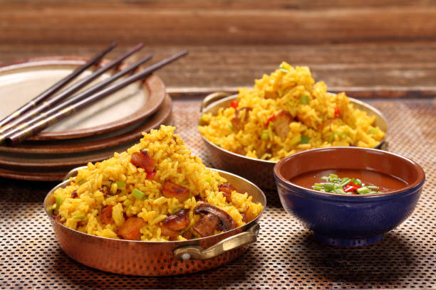 istock Chicken with basmati rice fried in stainless pan 1018791932