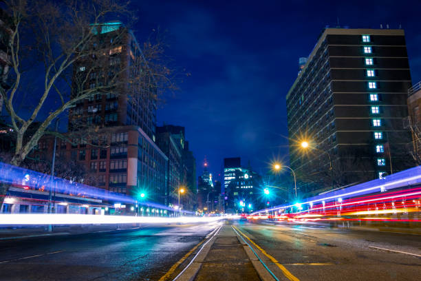 istock Night Street and Tracks from Car Headlights 1018792112