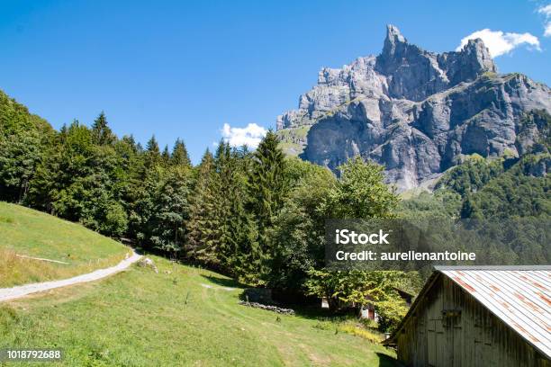 Chalet At The Cirque Du Fer À Cheval Stock Photo - Download Image Now - Chalet, Clear Sky, Cliff