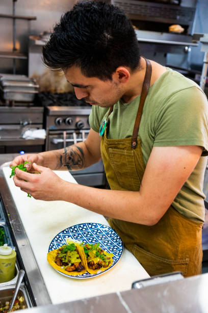 istock Mexican chef working in an authentic Mexican restaurant 1018795316