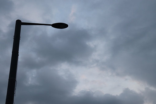 Clouds and street lights at dawn