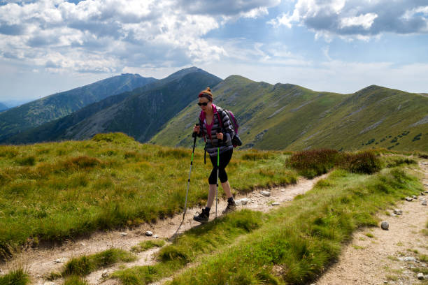istock Walking woman hiking on the mountains 1018797960