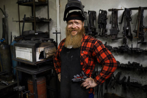 istock Satisfied welder in mask on head 1018801234