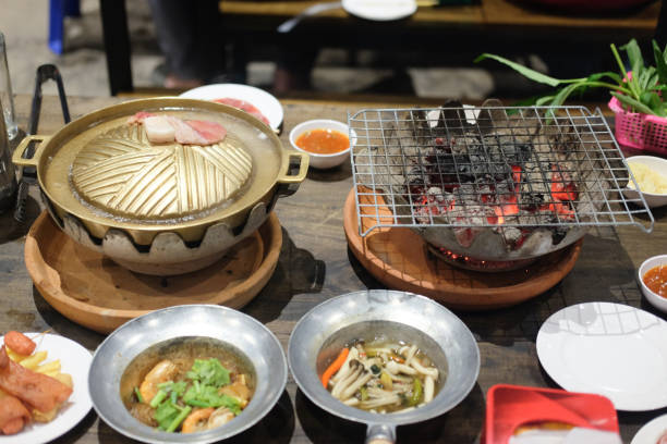istock Brass grilling pan and Grille on stove in buffet restaurant 1018804346