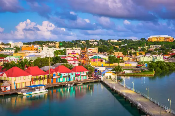 St. John's, Antigua and Barbuda cityscape over Redcliffe Quay at dusk.