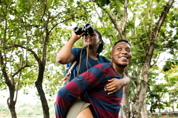 istock Man giving his girlfriend a piggyback ride 1018810576