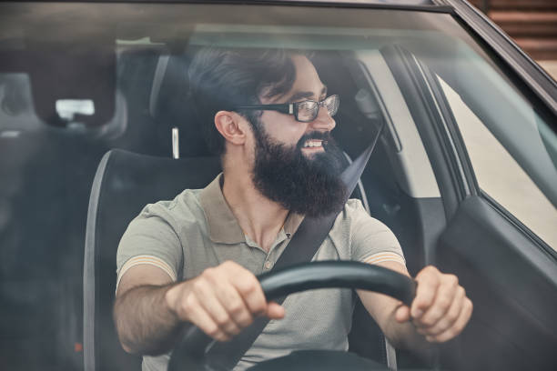 istock Happy driver with safety belt fastened 1018811572