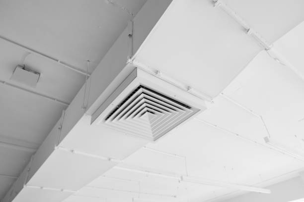istock Ventilation system on the ceiling of large buildings. Ventilation pipes in silver insulation material hanging from the ceiling inside new building. 1018812448