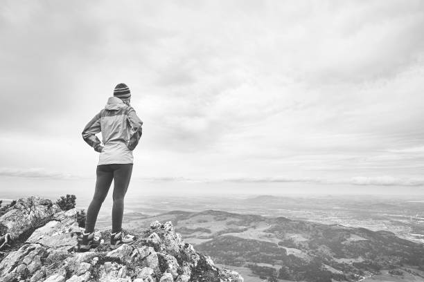 istock Woman on top of mountain 1018813510