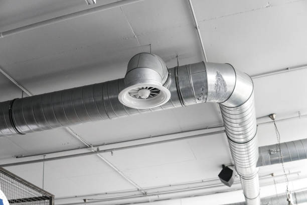 istock Ventilation system on the ceiling of large buildings. Ventilation pipes in silver insulation material hanging from the ceiling inside new building. 1018815338