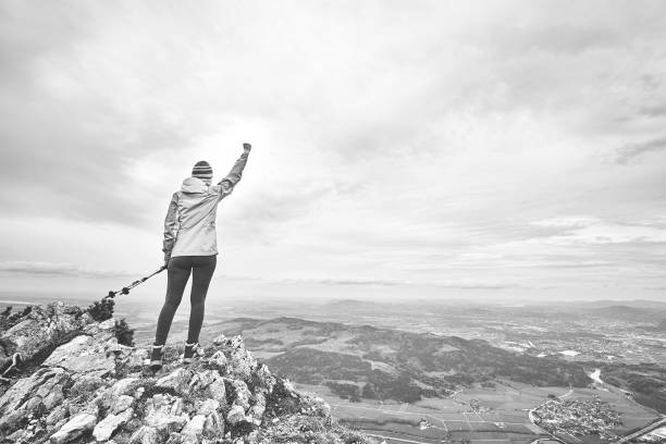 istock Woman on top of mountain 1018816950