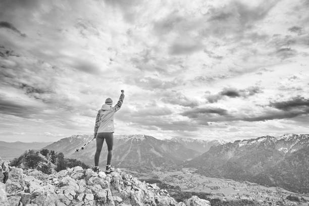 istock Woman on top of mountain 1018817202