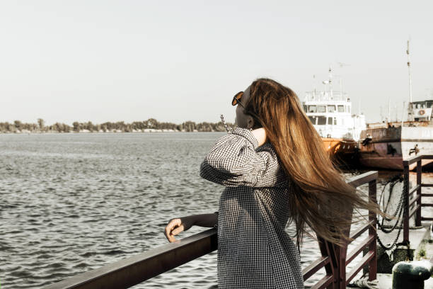 istock The girl admire the seascape. 1018822158