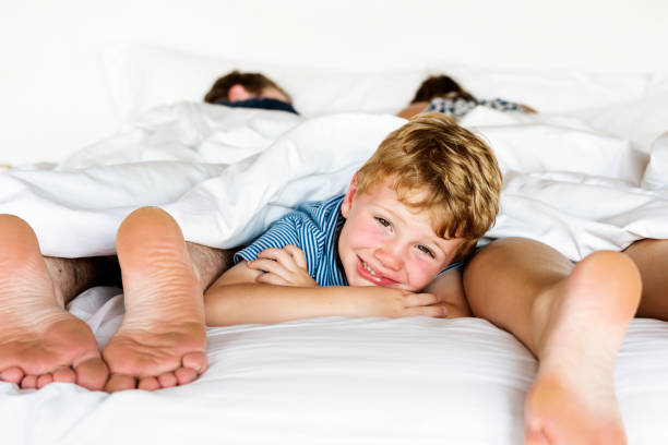 istock Whole family sharing a bed 1018822190