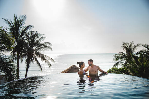 istock Couple relaxing in a swimming pool 1018822382
