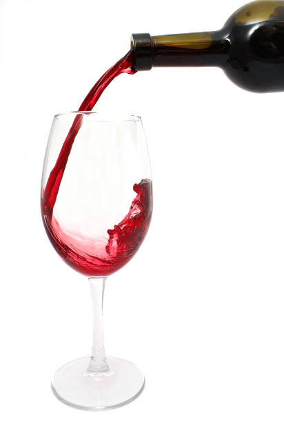 istock Pouring red wine into the glass 1018826034