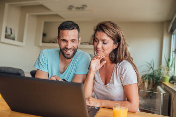 istock joyful couple shopping online 1018826168