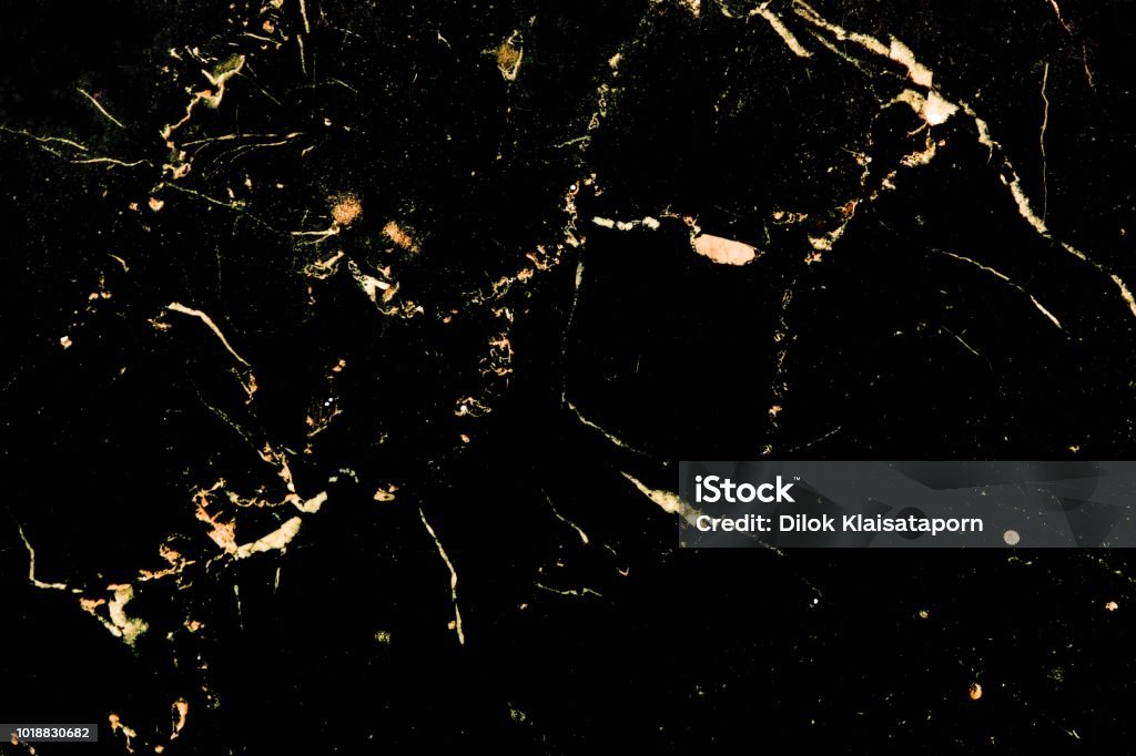 Luxury golden pattern design on black marble Luxury golden pattern design on black marble which it is used for poster brochure invitation cover book catalog wallpaper and texture. Gold - Metal Stock Photo