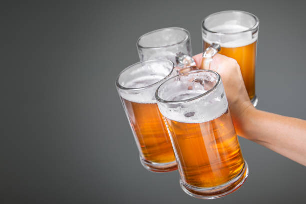 istock Beer Fest concept - hand holding glasses with beer 1018831148