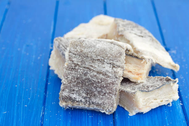 istock salted dry codfish on white wooden background 1018831798