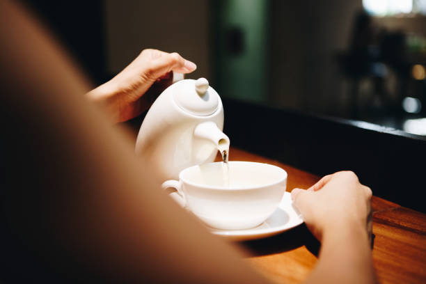 istock Woman pouring a hot drink 1018834440