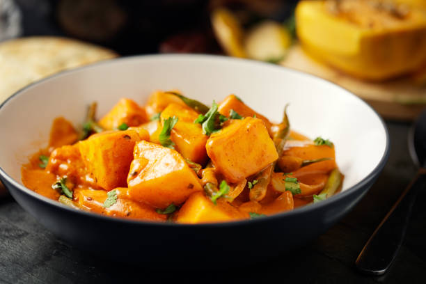 Healthy butternut squash and beans curry Home made freshness butternut squash and green beans tikka with wild rice and naan bread curry stock pictures, royalty-free photos & images
