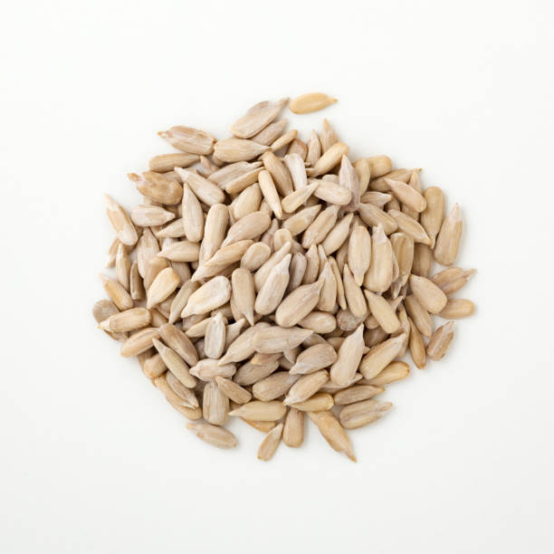 istock Sunflower seeds isolated on white 1018840626