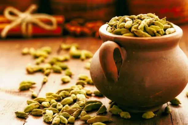 Photo of Wooden table of colorful spices.