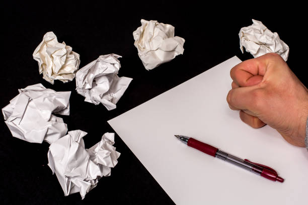 istock Crumpled paper, pen and stationery as a symbol for missing words when writing 1018851096
