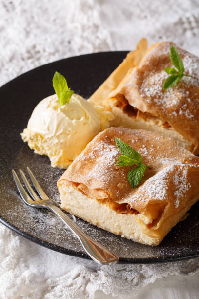 istock Delicious Viennese cheese strudel with vanilla ice cream close-up. vertical 1018858914