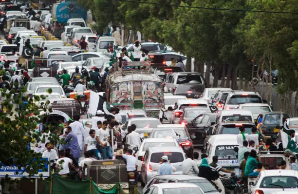 This photo was taken on 14th August which is celebrated as the day Pakistan got independence . Its taken in Karachi which is Pakistans biggest city, and i took this to show how people violate traffic rules and dont follow the law which leads to many cars being stuck in traffic jams for a long time.