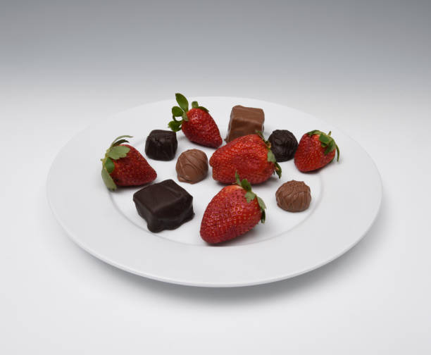 istock Dark and milk chocolate candies and strawberries 1018869822