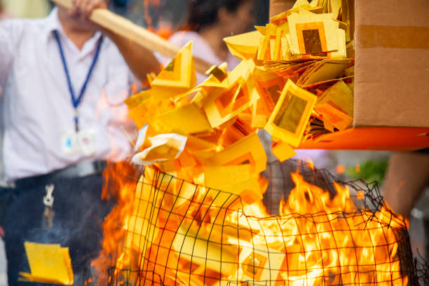 China, traditional religion, customs, Zhongyuan Purdue, Chinese Ghost Festival, believers, burning paper money stock photo