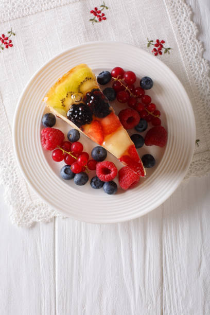 istock Slice of fruit jelly cake closeup on a plate. vertical top view 1018874238