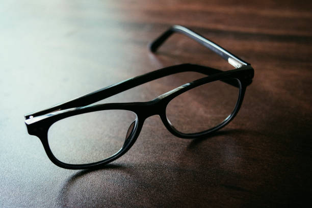 istock Black Spectacle on wooden table 1018874388