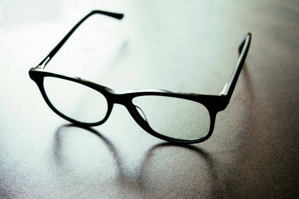 istock Black Spectacle on wooden table 1018874398